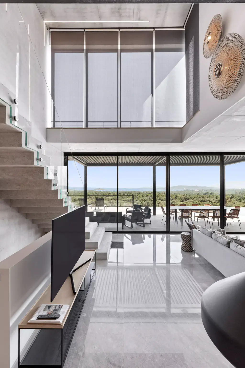 Double-height living room: roller blinds on the high glazing fully lowered.