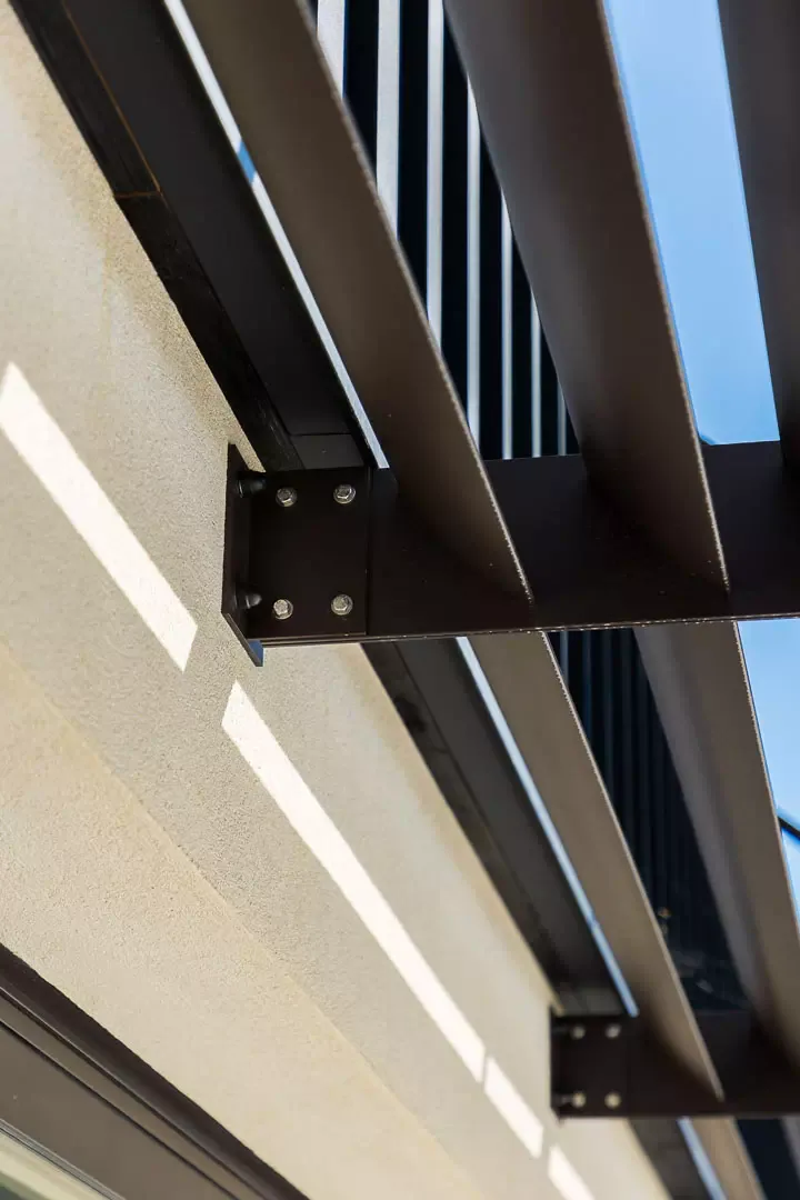 Detail of the mounting plate and the steel louvres of the brise-soleil.